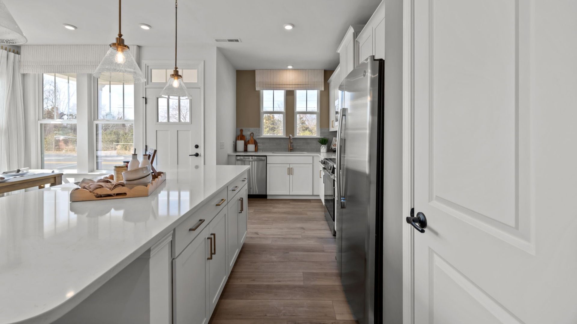 The Rochester Plan by DRB homes kitchen with island and modern features in Charlotte, NC.