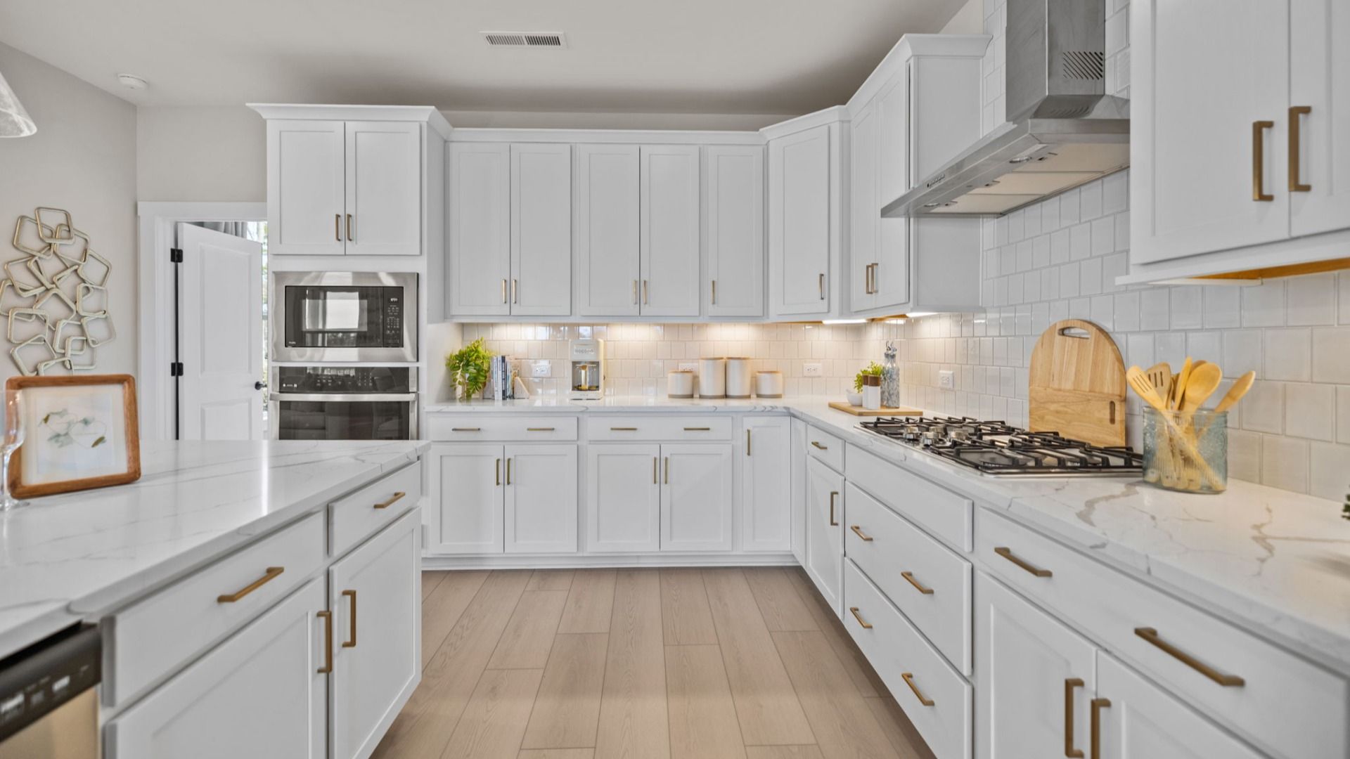 The Stonefield Home Plan by DRB Homes in Belmont, NC. - Kitchen featuring an oversized bar and butler's panty