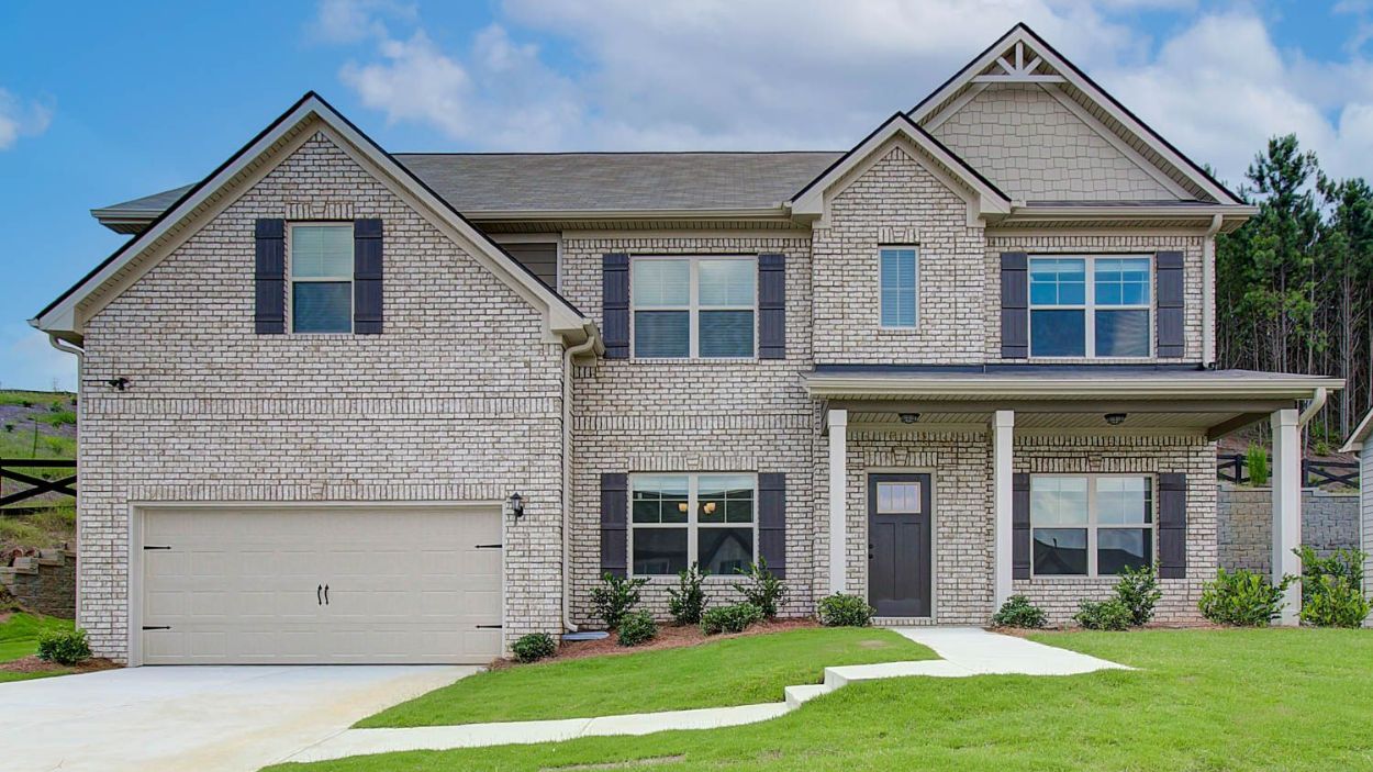 Vickery two-story brick exterior new construction single-family home with two-car garage at Berkeley Lakes.