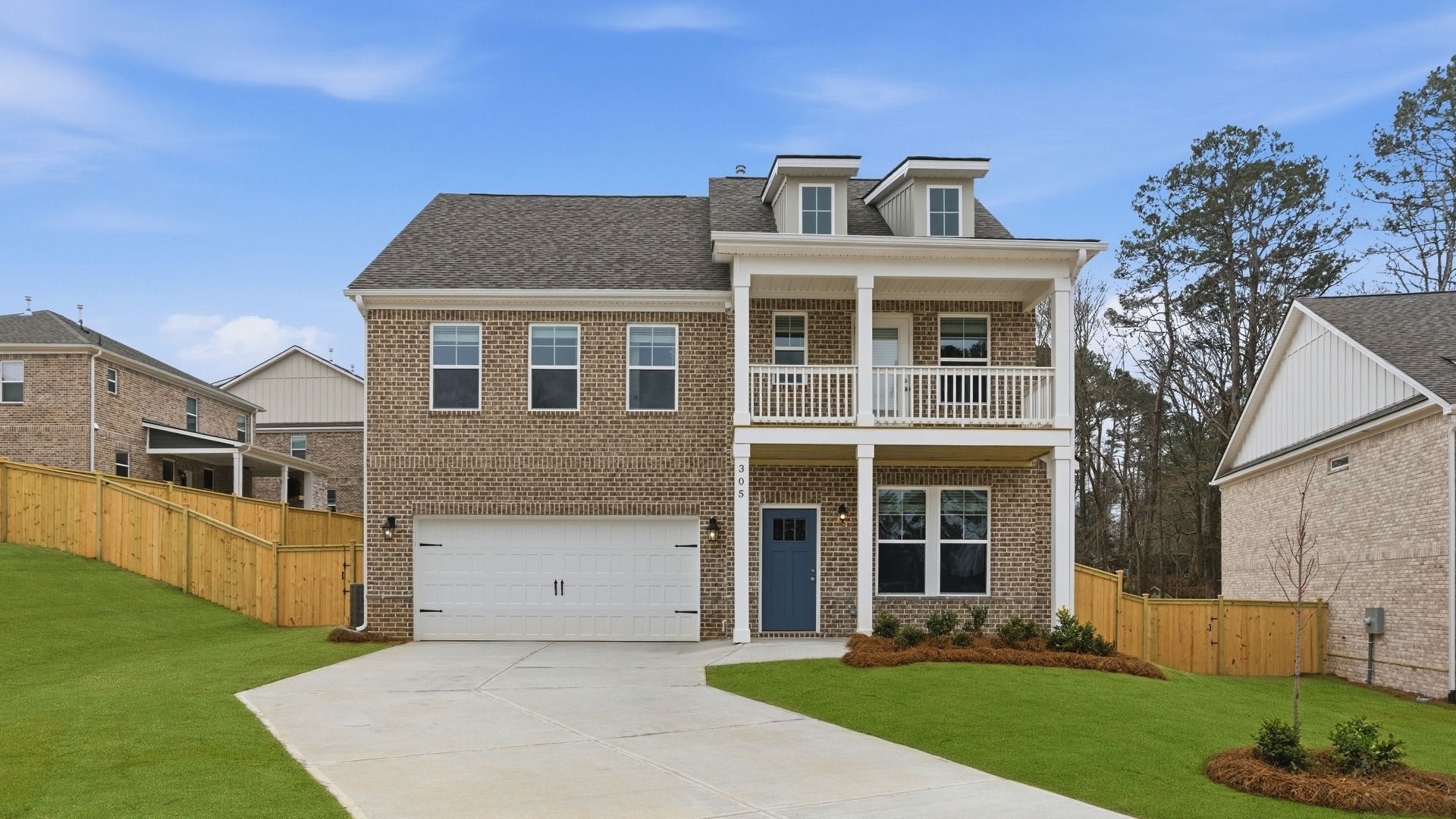 Pelham new construction single-family home with brick exterior and two-car front-entry garage at Burchwood.