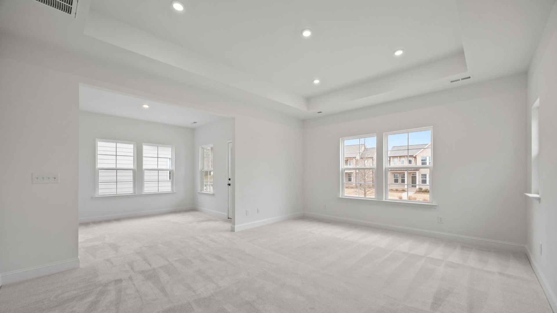 The Brentwood Plan by DRB Homes in River District, Charlotte NC.- Primary Bedroom with Sitting Area
