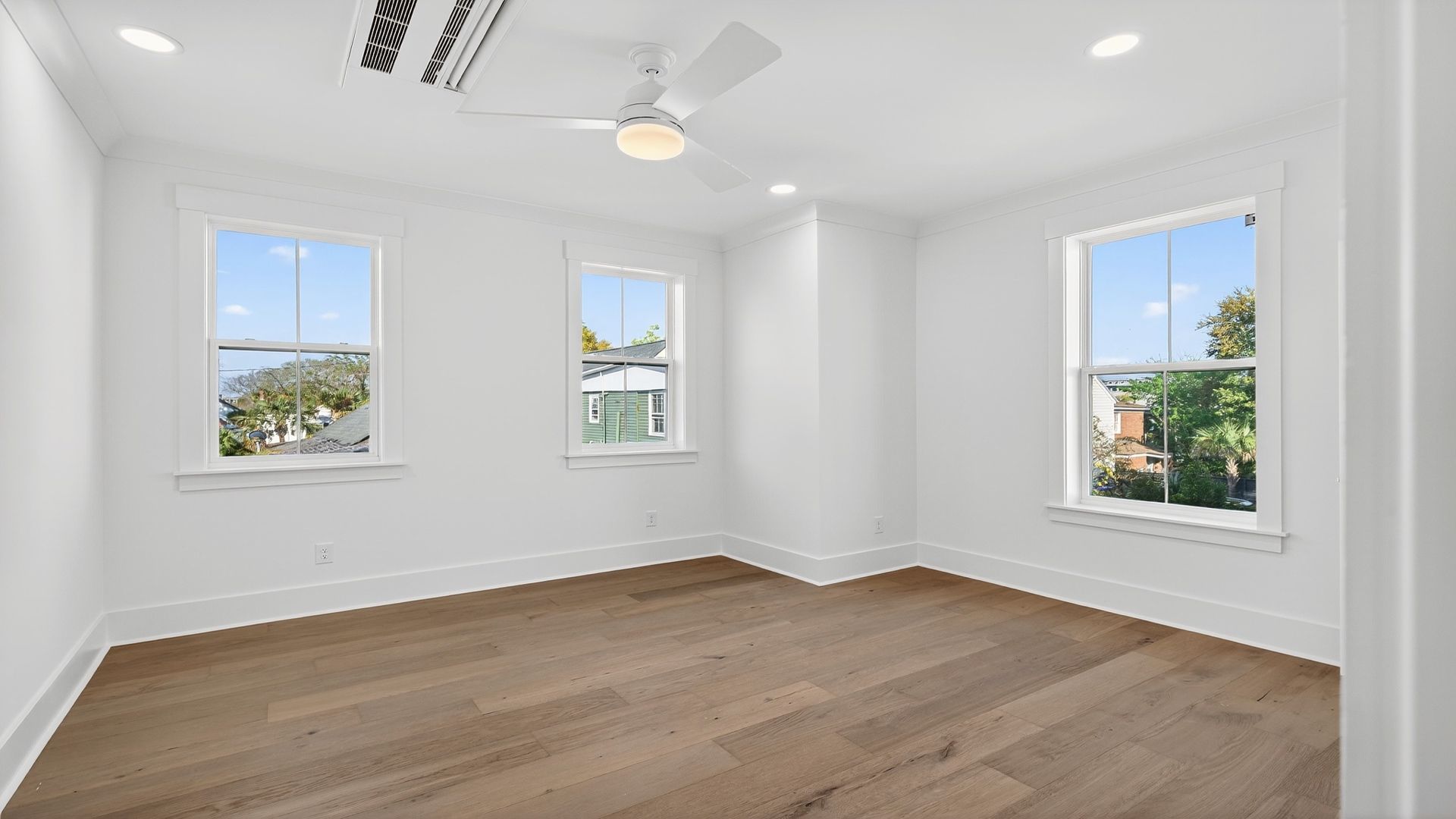 The Seabrook primary bedroom offers a bright, spacious retreat with large windows and modern finishes.