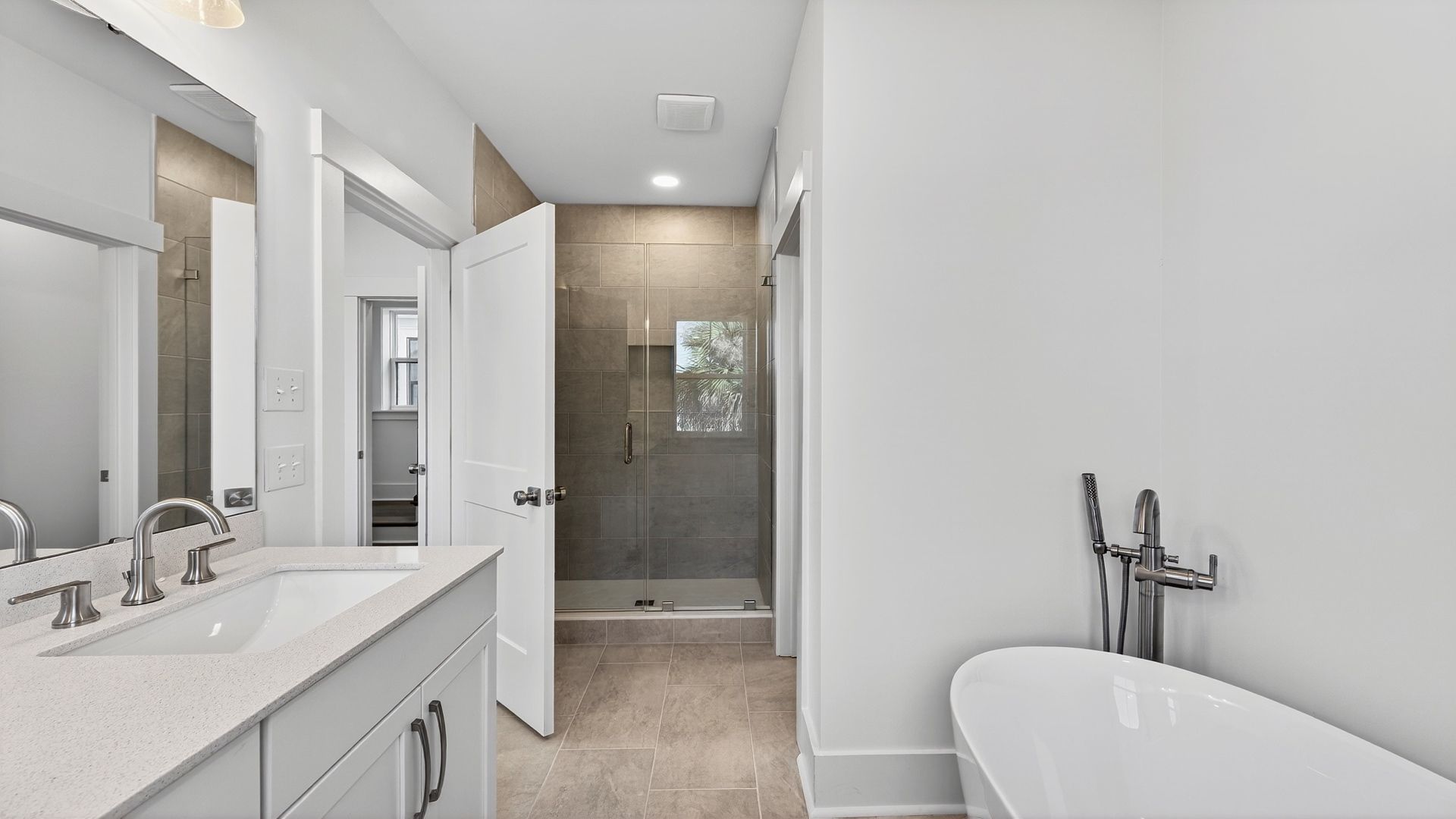 Spacious primary bathroom in the Seabrook floor plan with dual vanities and stylish finishes.