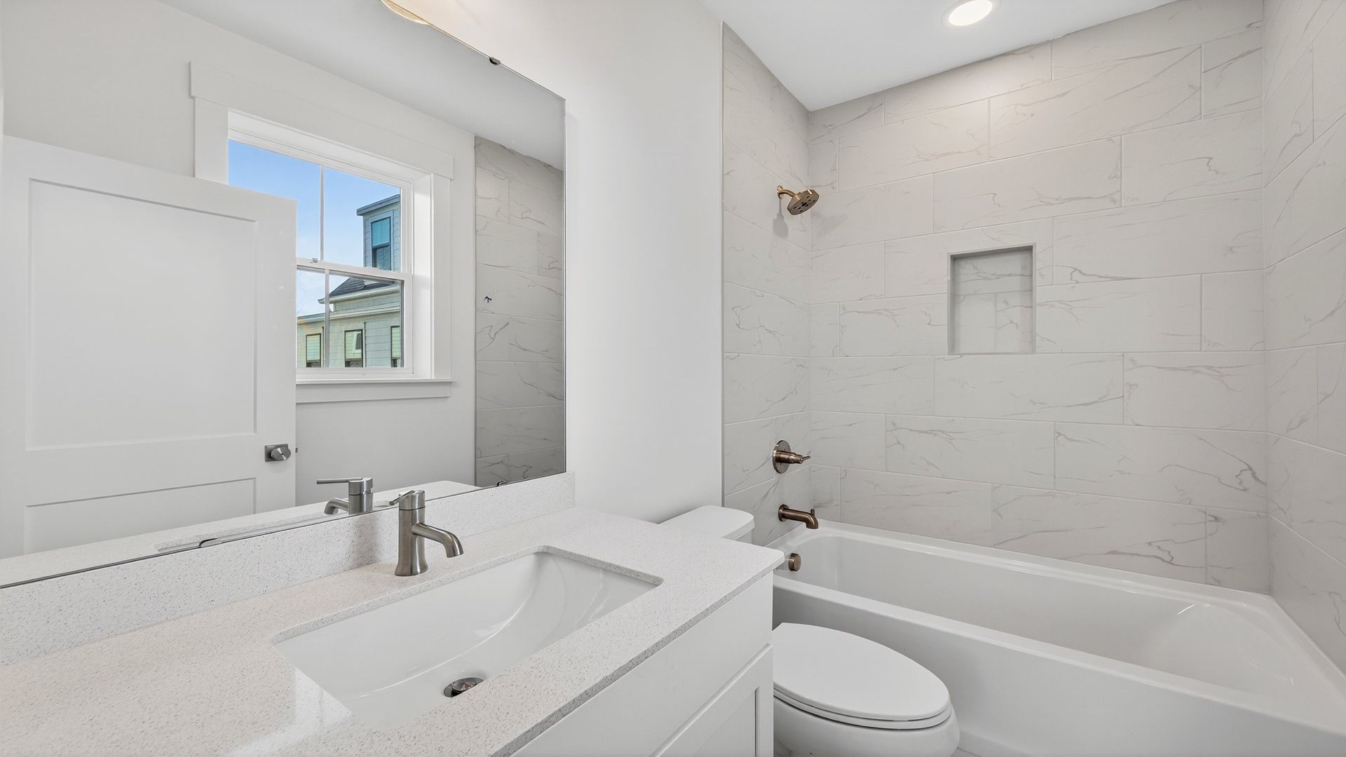 Secondary bathroom in the Seabrook floor plan featuring modern fixtures and stylish finishes.
