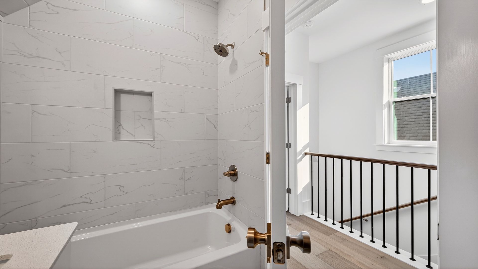 Secondary bathroom in the Seabrook home featuring a tiled shower and stylish finishes.