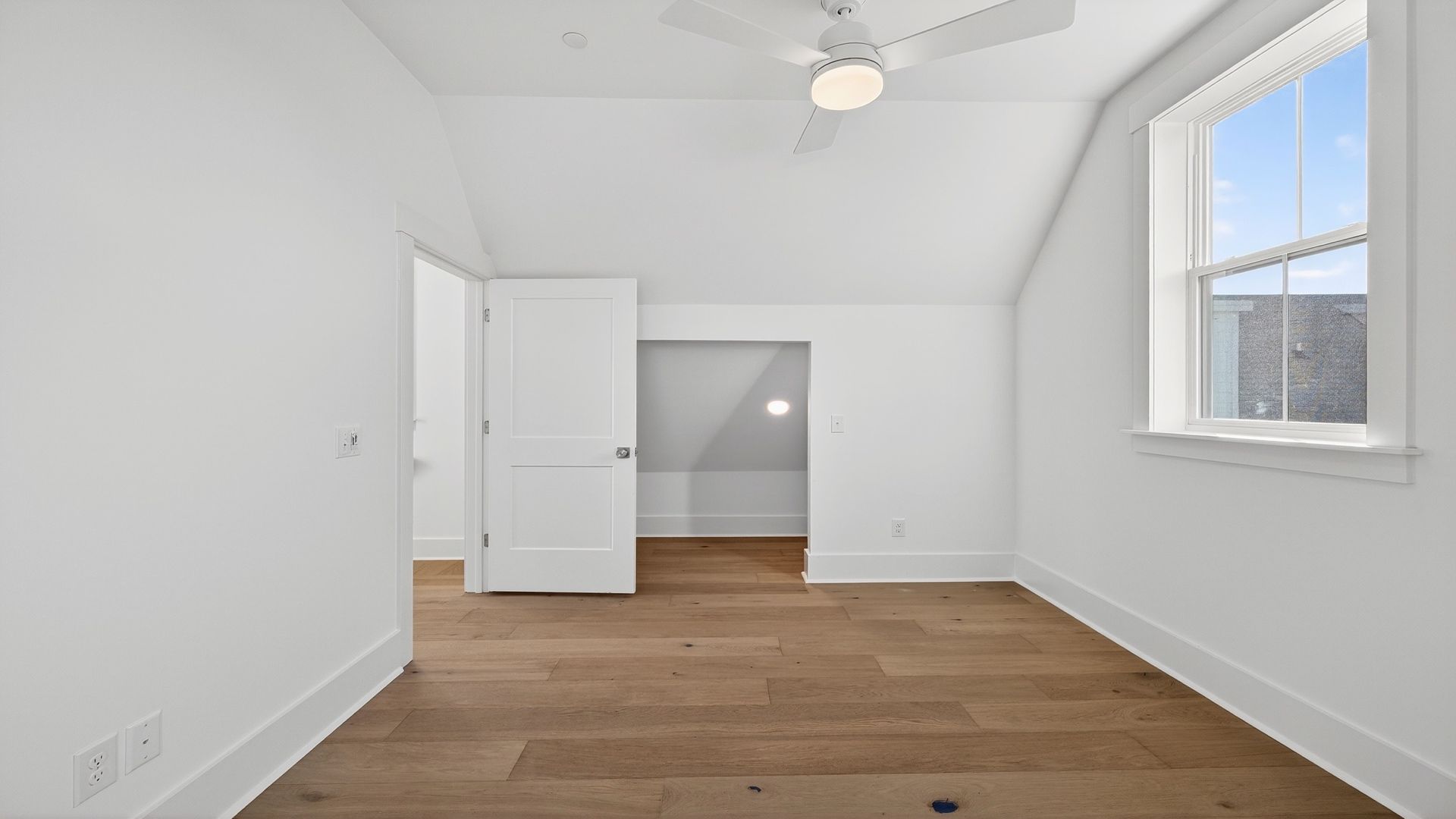 Secondary bedroom in the Seabrook home featuring comfortable living space and additional storage options.