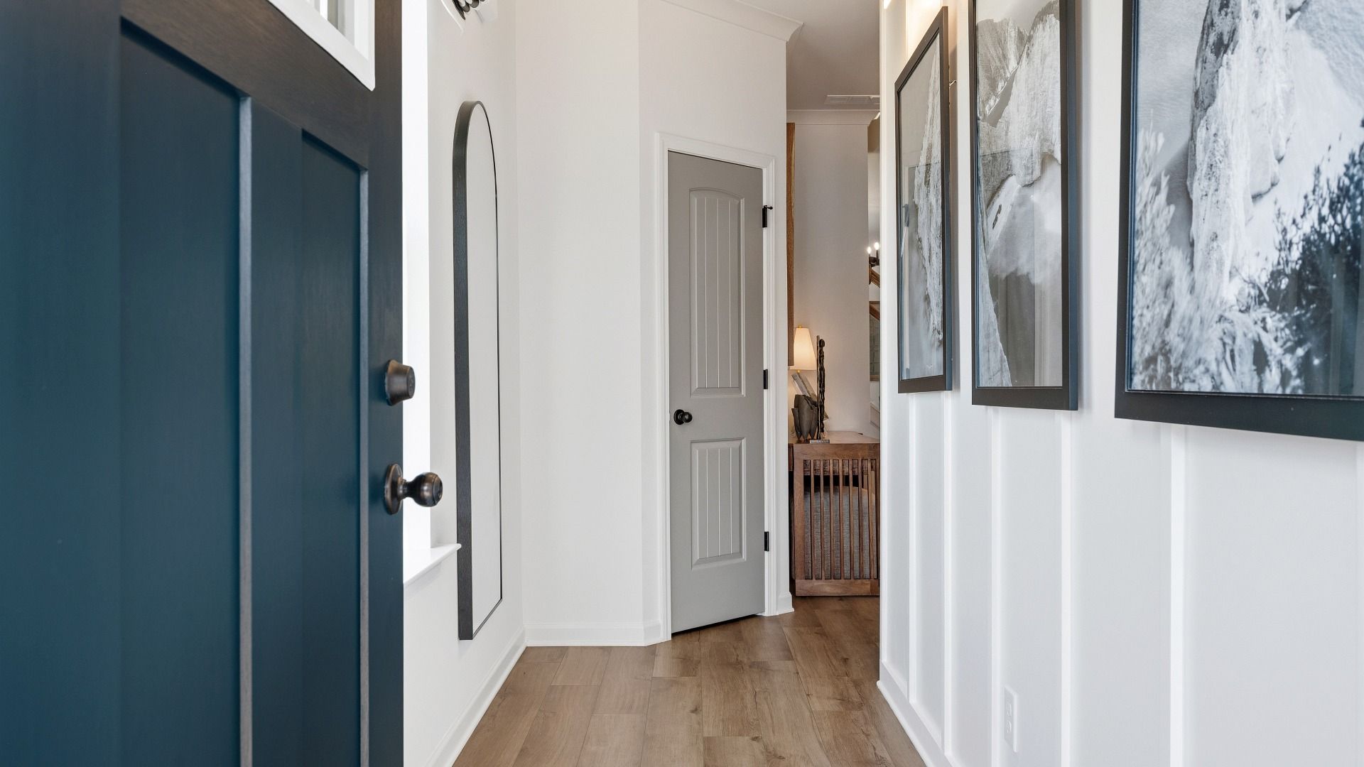 Welcoming entryway with tall ceilings, modern trim, and natural light in Langley Overlook townhome in Loganville, GA.