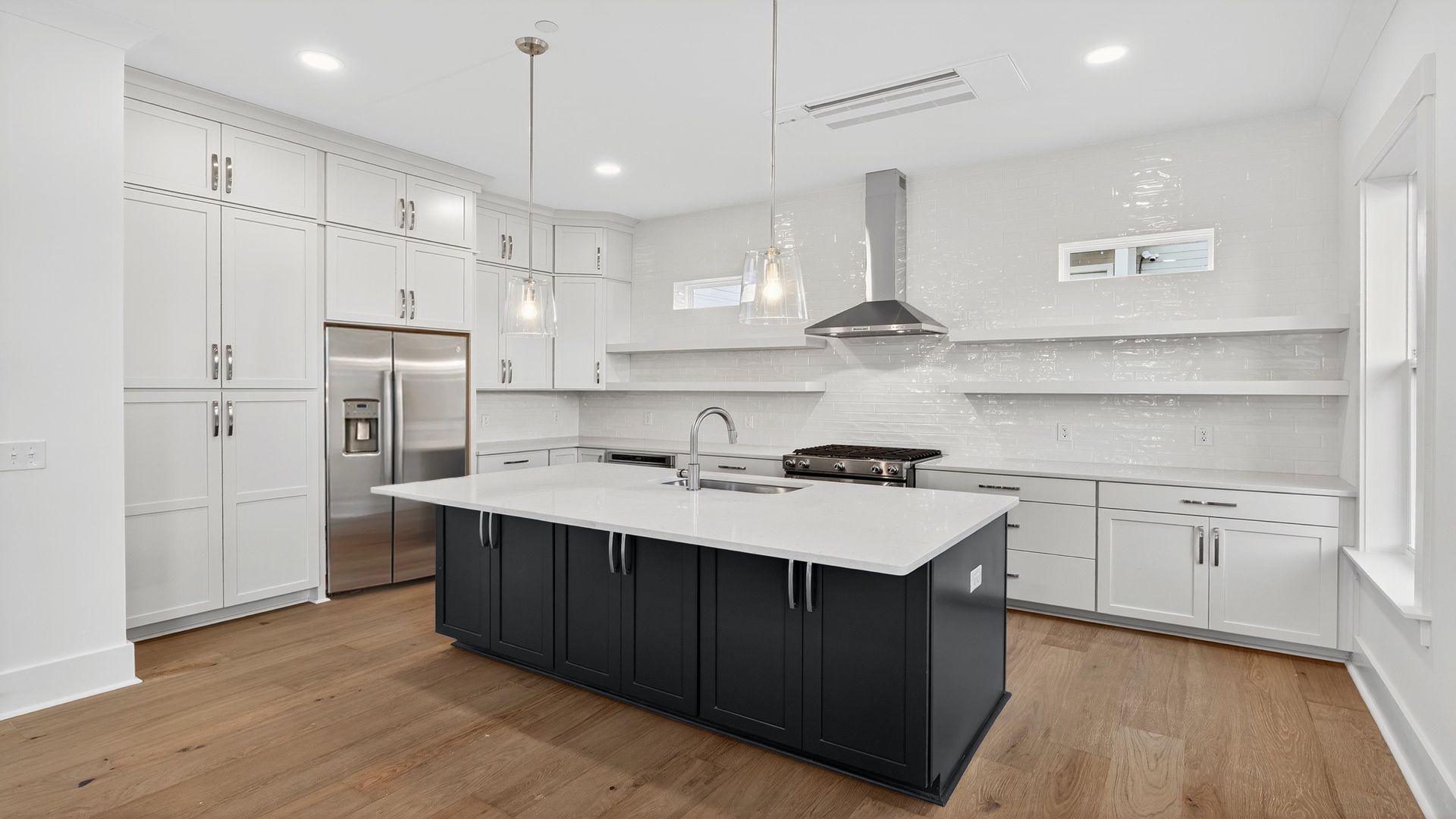 The Seabrook kitchen offers a large center island, designer finishes, and open flow for entertaining.