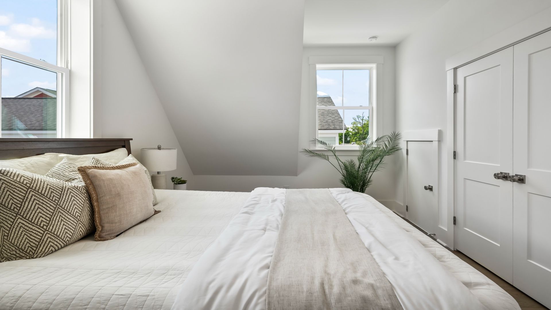 Secondary bedroom in the Sullivan home plan featuring natural light, comfortable living space, and generous closet storage.