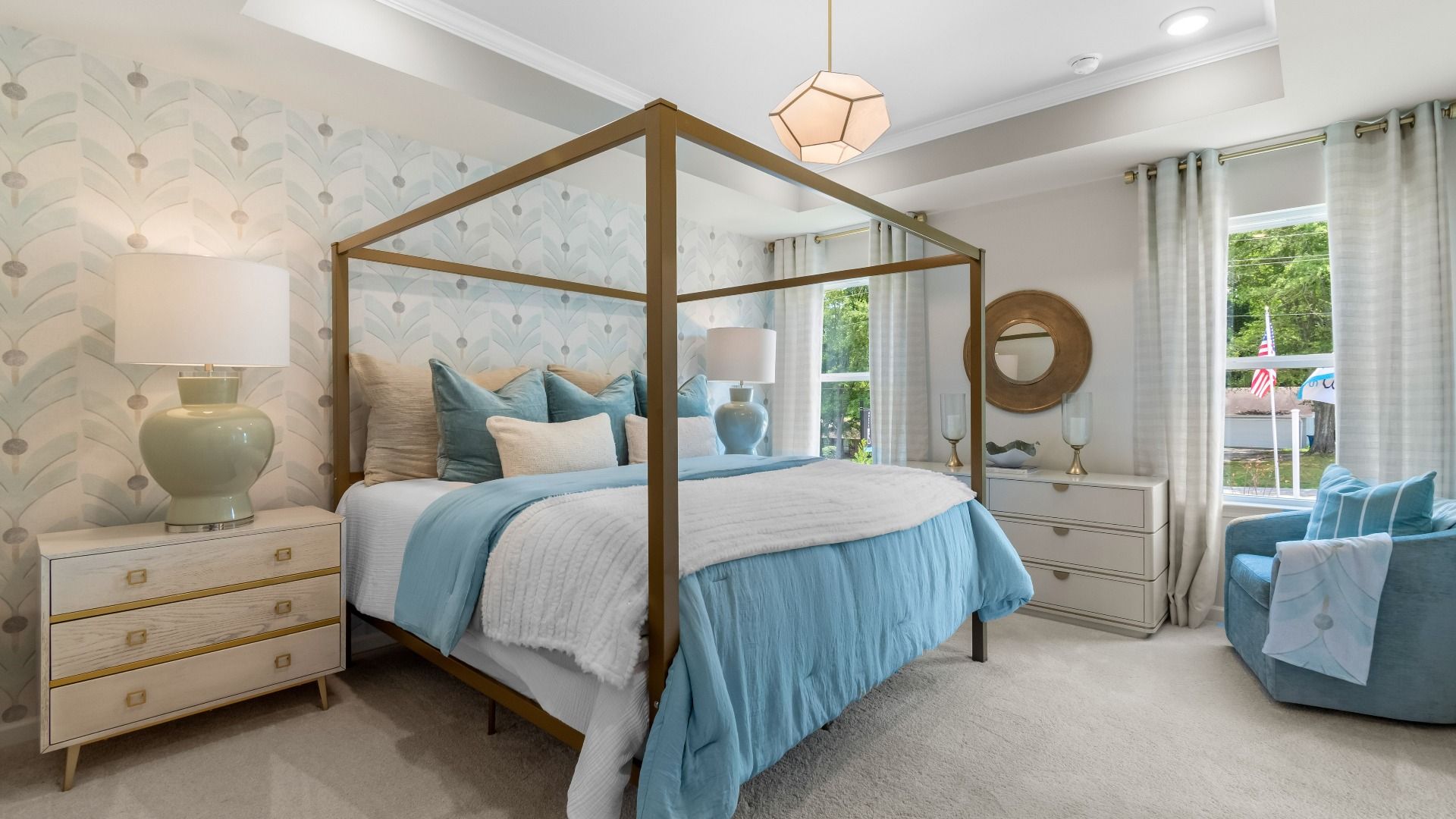 Stylish primary suite in new construction townhome featuring soft textiles and calming neutral palette.