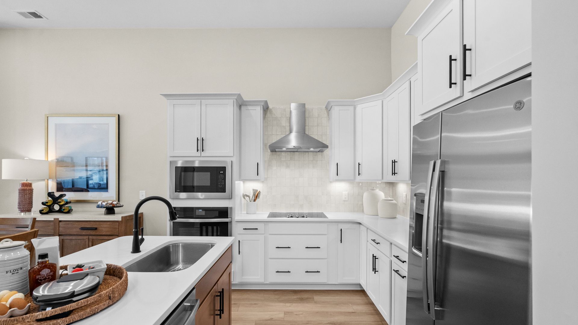 Open kitchen in the Summit home plan with modern cabinetry and natural light.