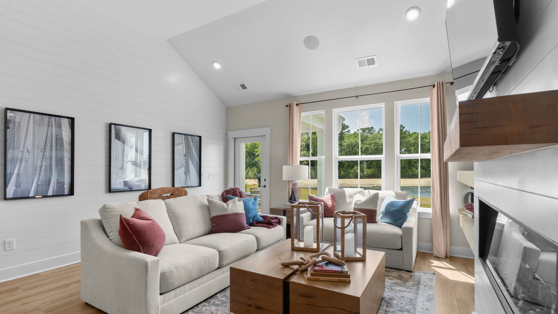 Inviting living room in the Summit home plan with bright windows and open design.