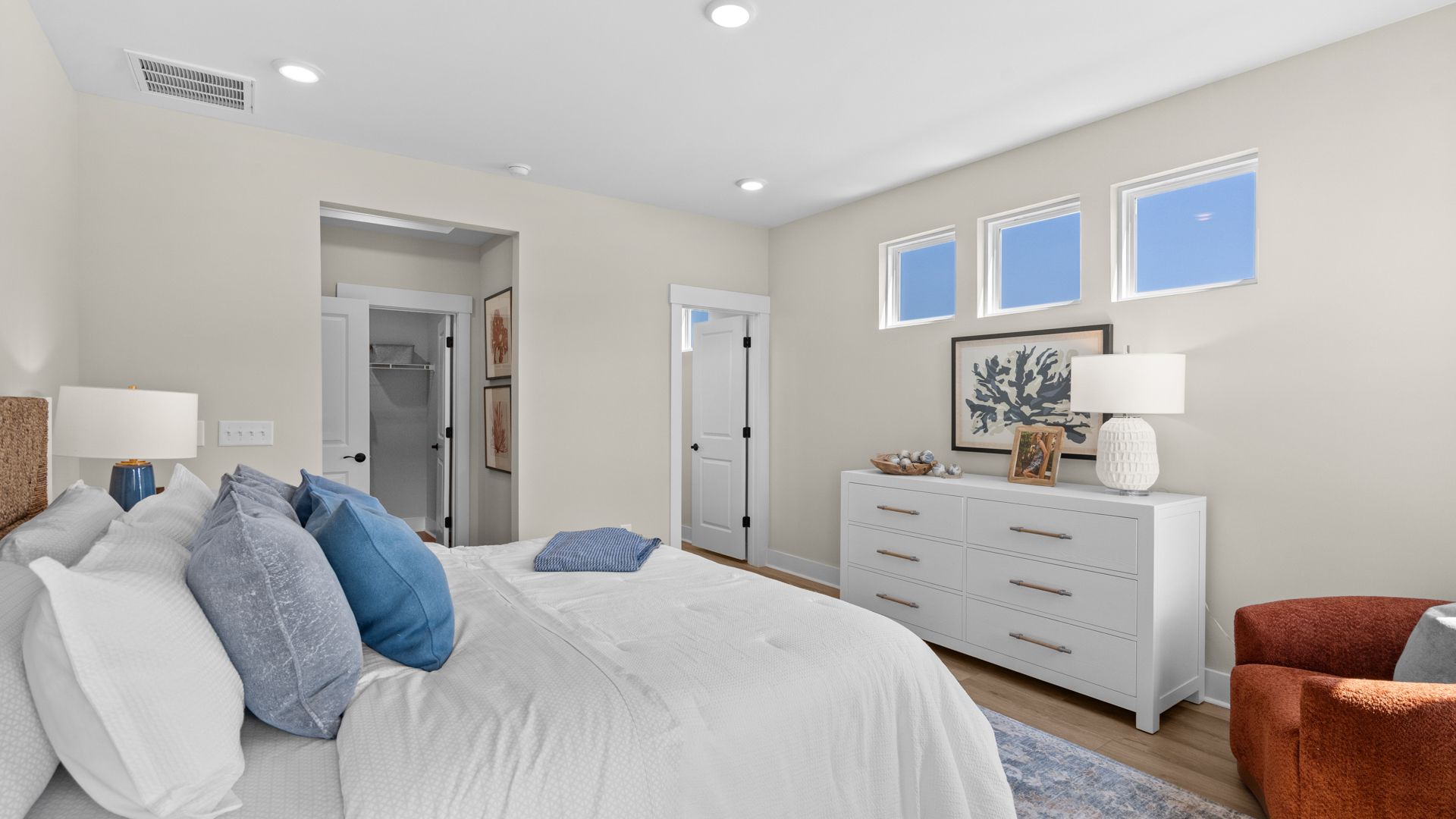 The Summit primary suite offers a spacious retreat with comfort and style.