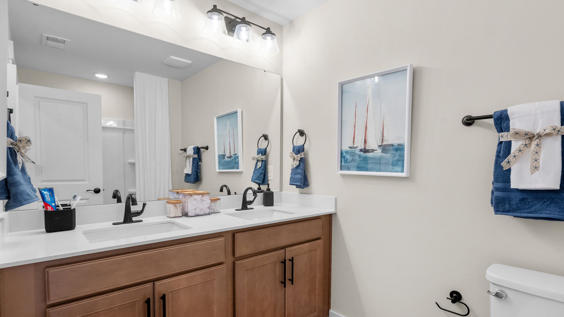 Second-floor secondary bathroom in the Summit home plan with modern fixtures and style.