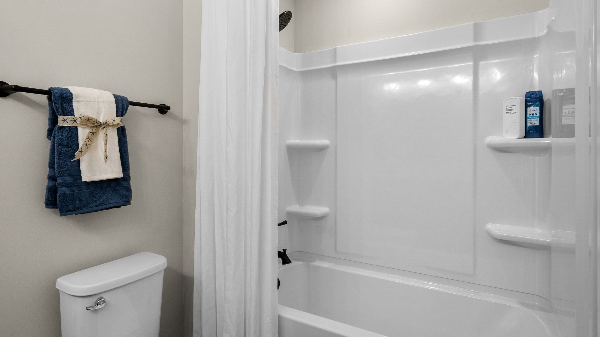 Second-floor bathroom shower with functional design and stylish finishes.
