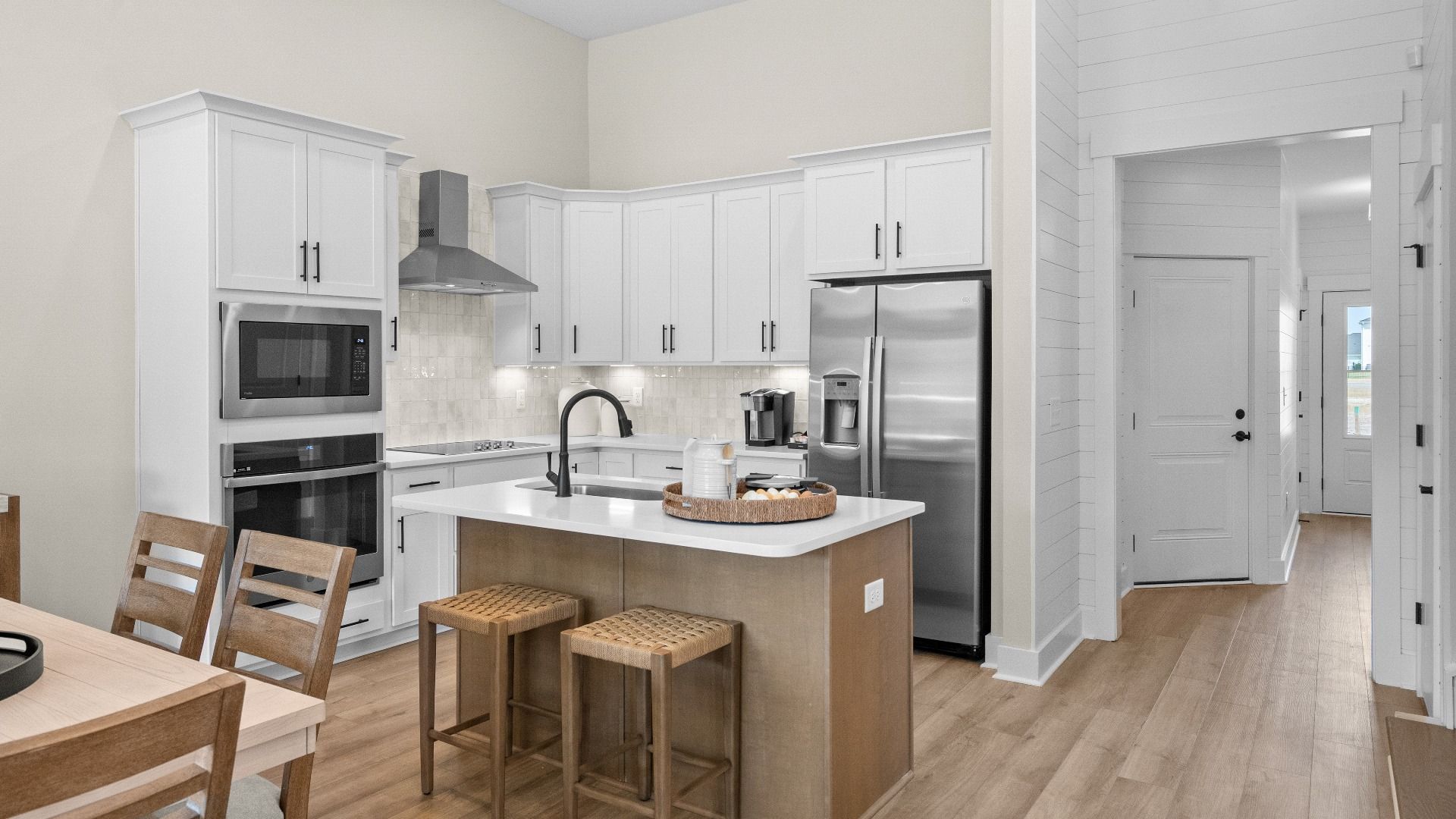Open kitchen in the Summit home plan with modern cabinetry and natural light.