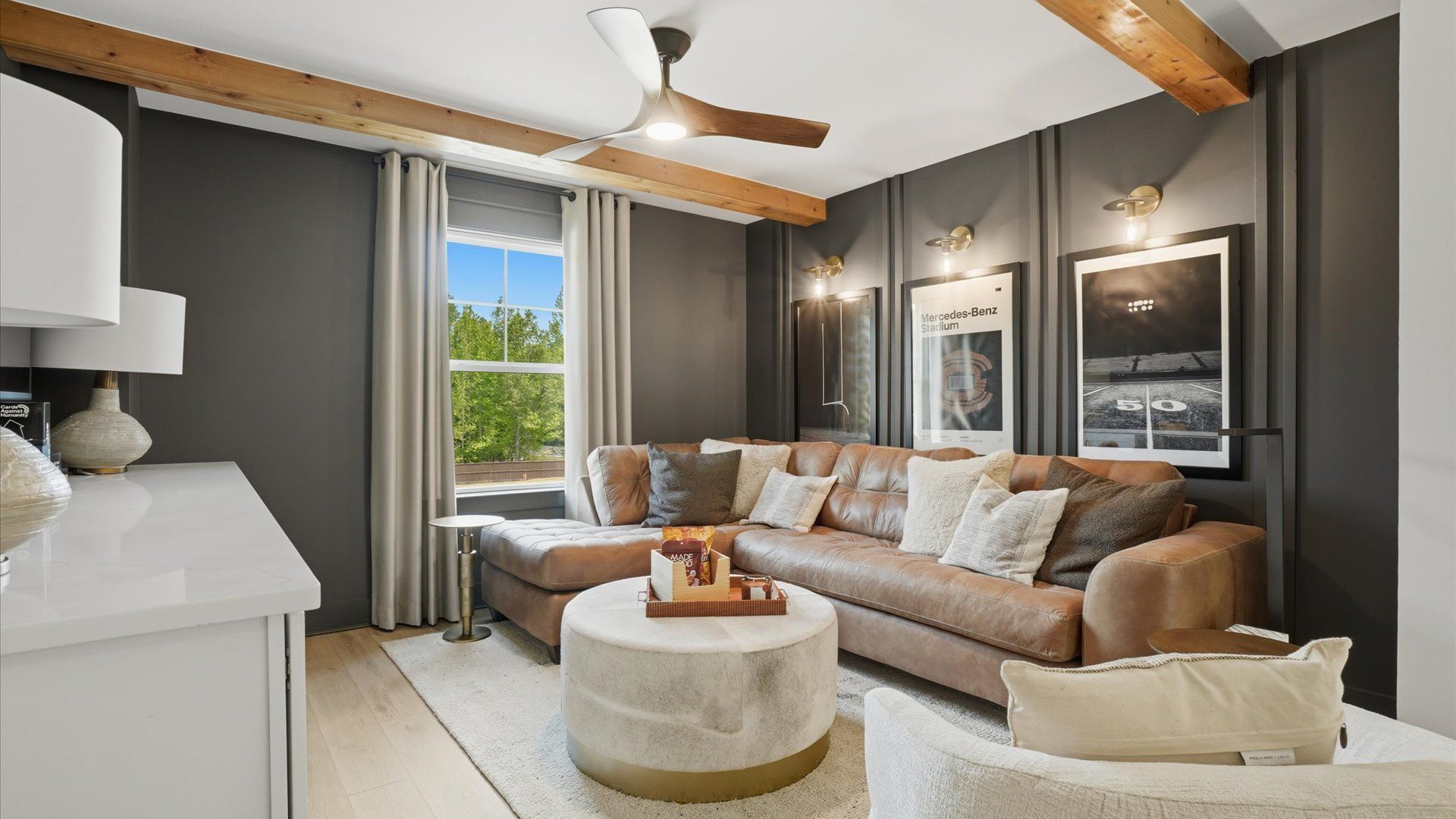Comfortable and elevated loft area with natural light and wood beams at Northcroft in Loganville, GA.