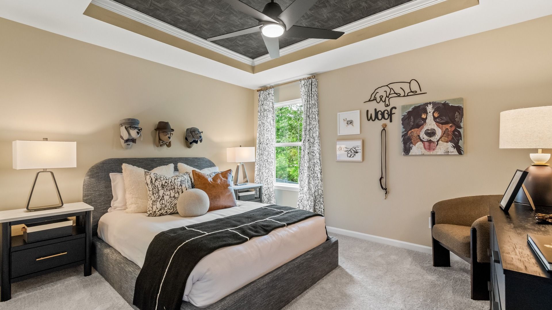 Spacious secondary bedroom with neutral finishes and tray ceiling at Enclave at Evergreen in Fairburn, GA.