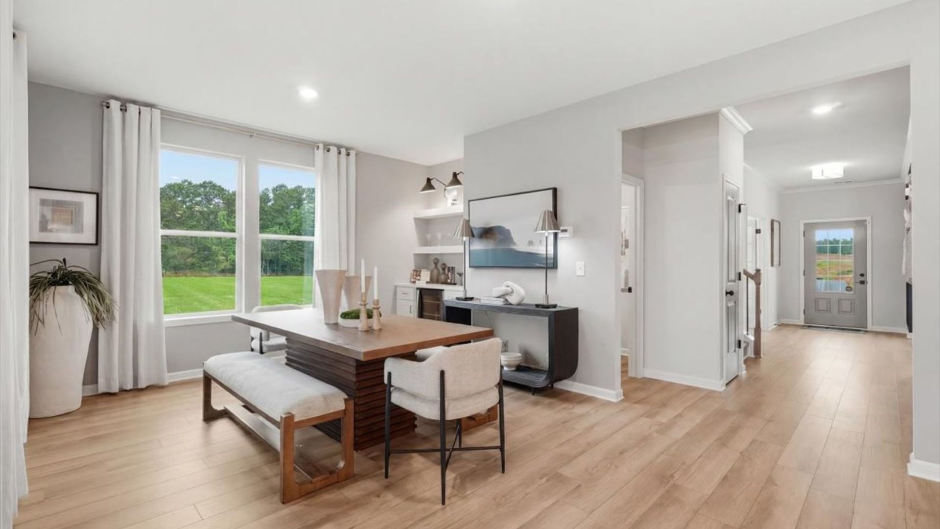 Stonefield open-concept breakfast area with natural light and ample space for dining at Brighton in Locust Grove, GA.