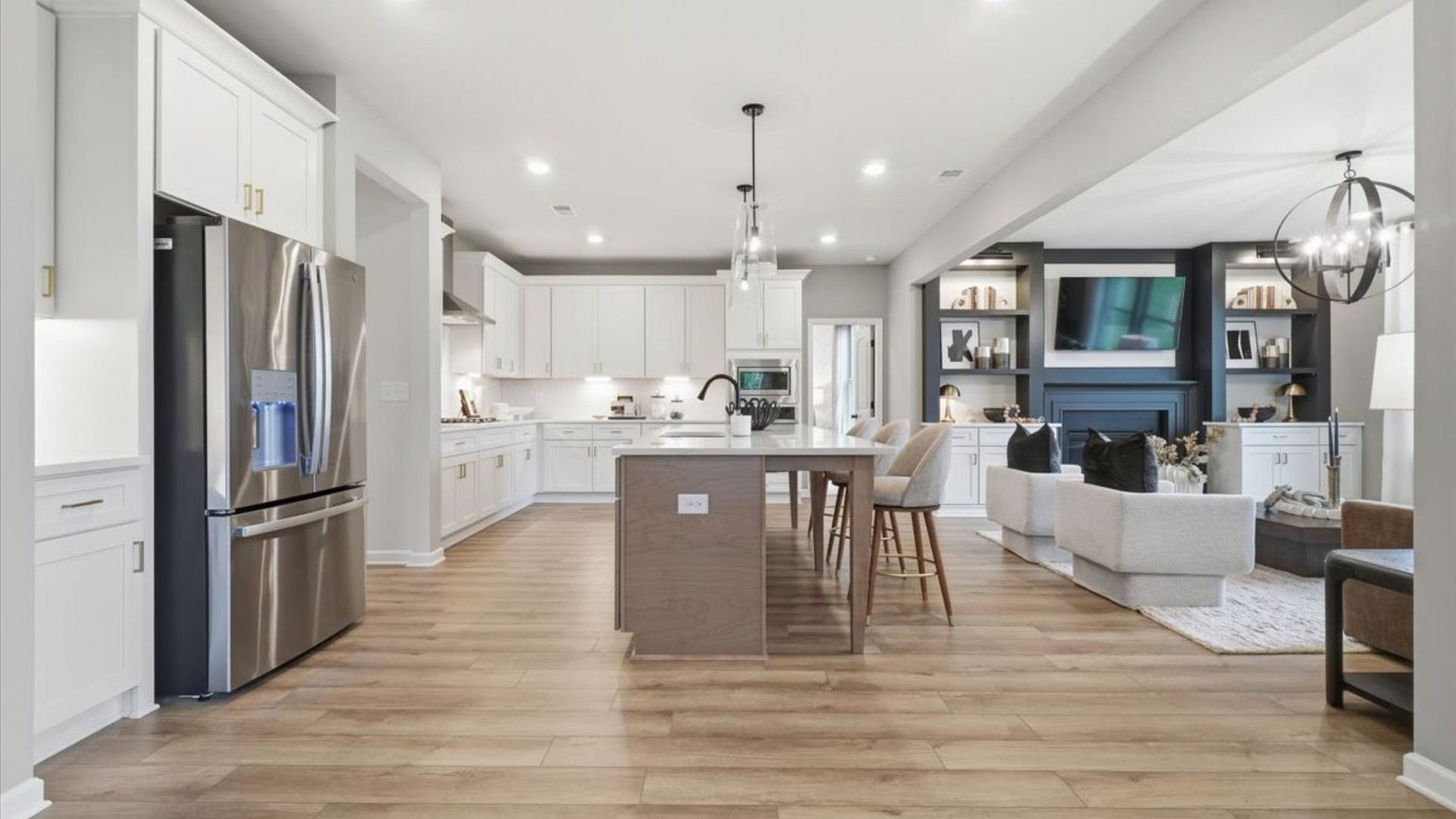 Open-concept kitchen with connection to breakfast area and family room in the Stonefield at Brighton.