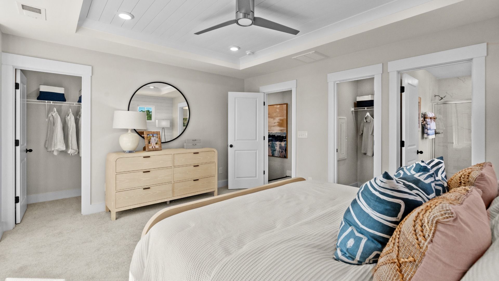 Primary suite with walk-in closet & en suite bathroom in a DRB Homes Brookgreen model home