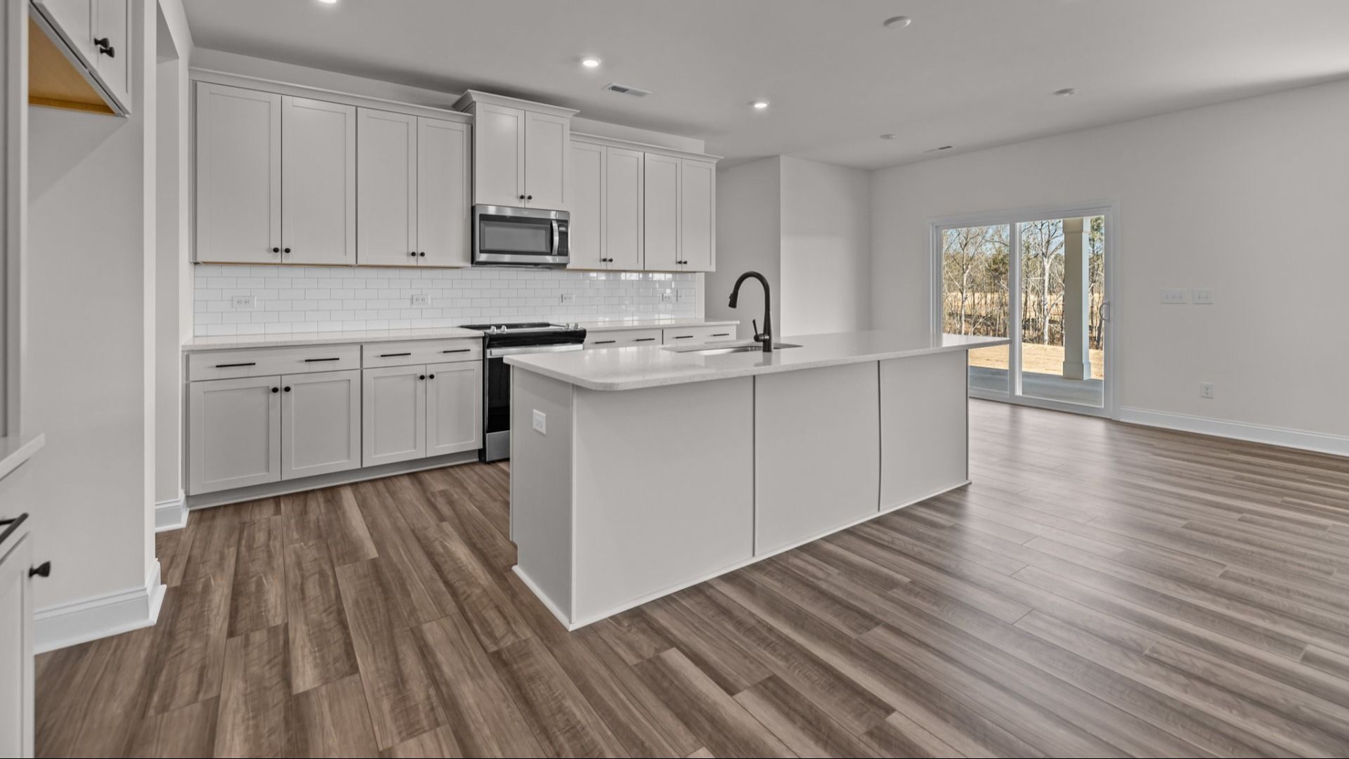 The Norris Plan by DRB Homes in Michaux Gardens - Kitchen & Living Space (Representative Photo)