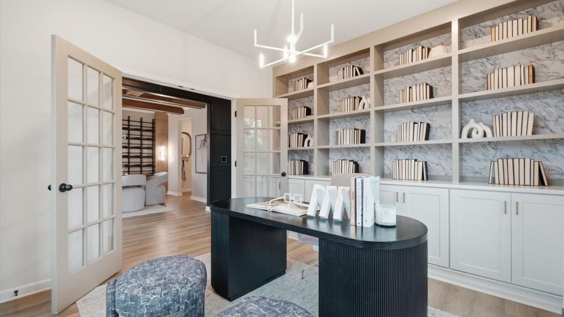 Stonefield office with double-door entry, built-in shelving, and LVP flooring at Brighton in Locust Grove, GA.