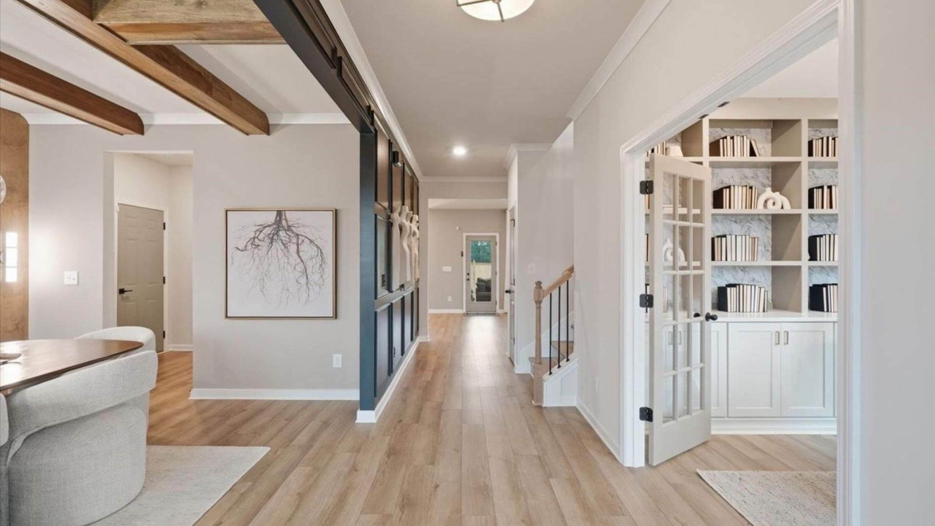 Stonefield open foyer with LVP flooring and views to dining room and study at Brighton in Locust Grove, GA.