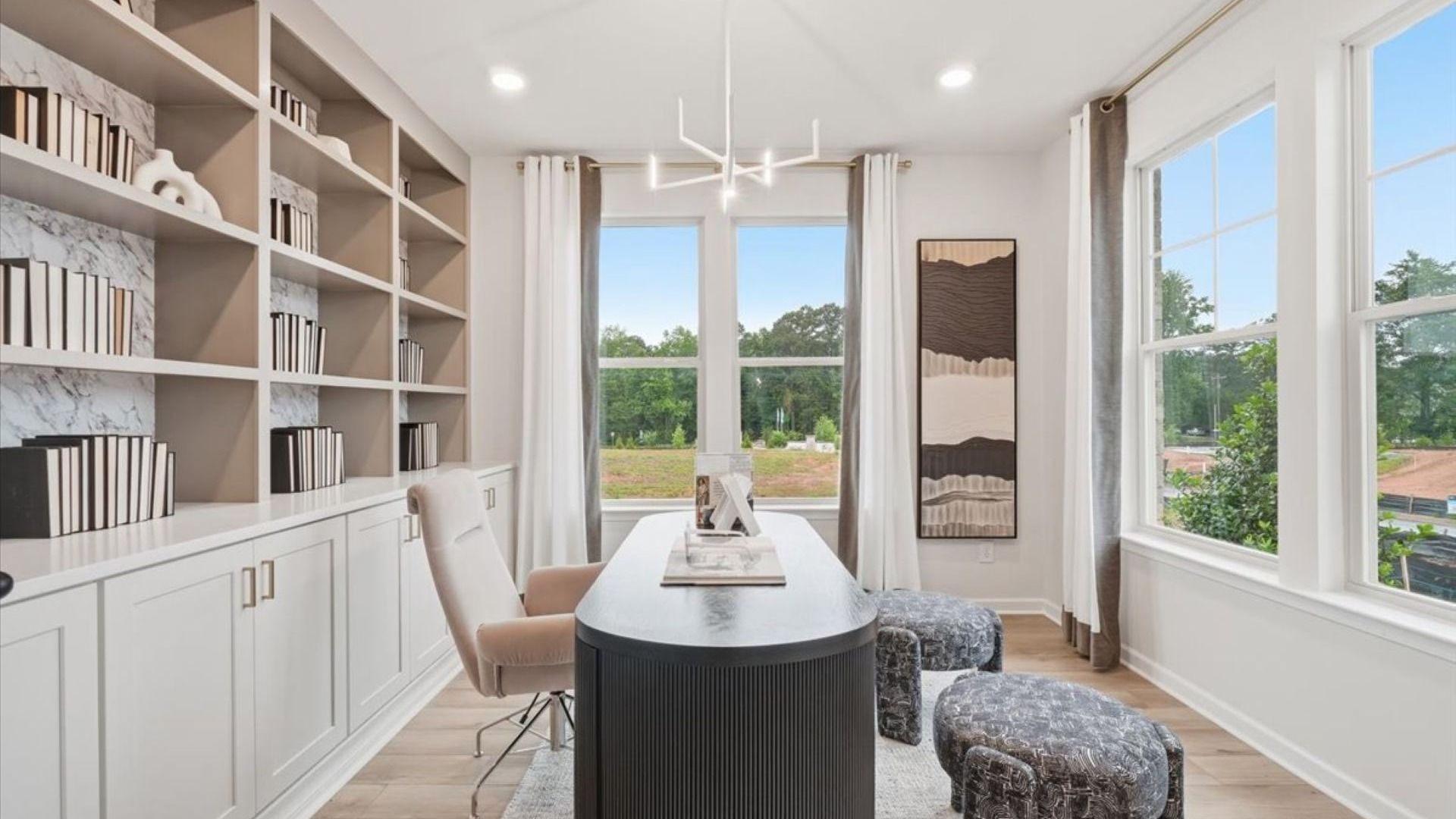 Stonefield office with double-door entry, built-in shelving, and LVP flooring at Brighton in Locust Grove, GA.