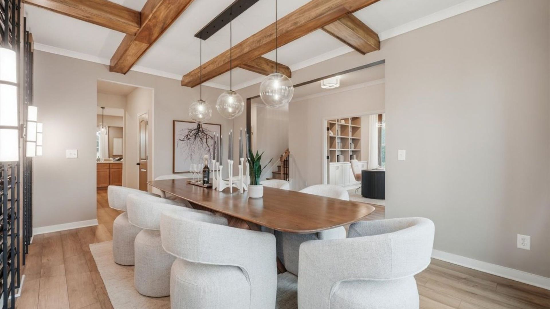 Stonefield dining room with built-in beverage area featuring wine cooler, cabinets, and open shelving at Brighton.