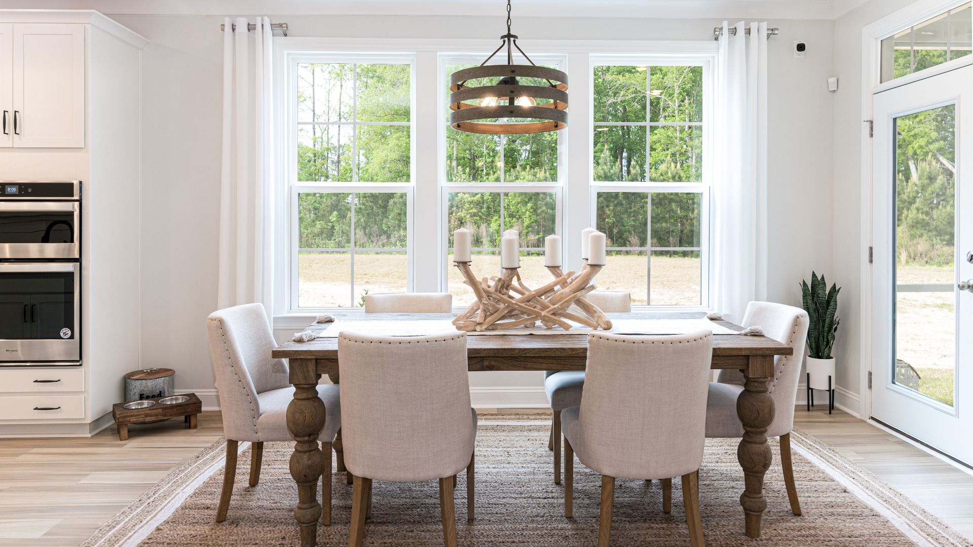 dining space with tons of light and door to rear screen porch