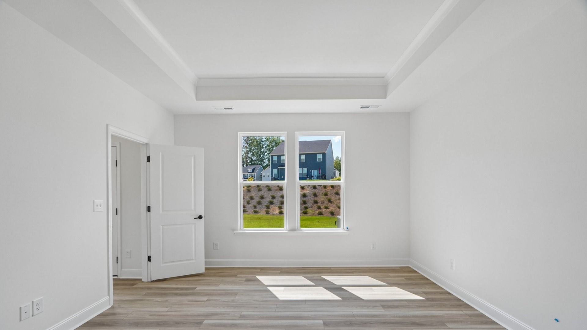 The Freesia Plan in Farms at Bellingham, Mooresville NC - Primary Bedroom with Tray ceilings
