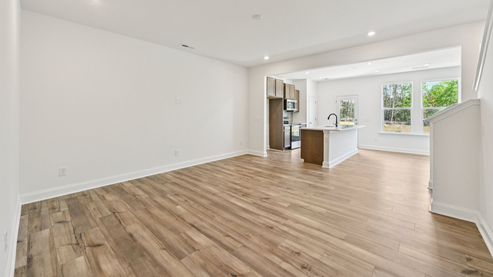 The Litchfield Plan by DRB Homes in Bell Glen - Living & Kitchen