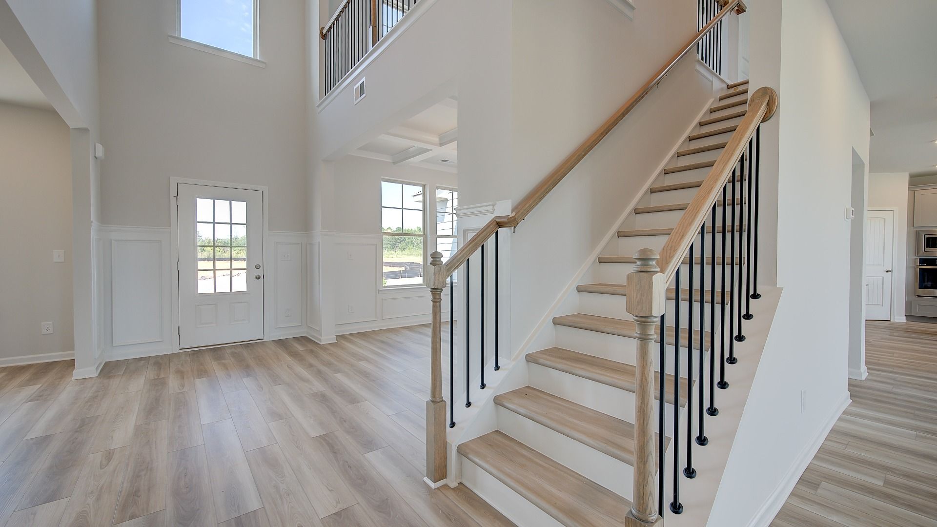Clarity open foyer with staircase and LVP flooring at Brighton new construction single-family home in Locust Grove, GA.