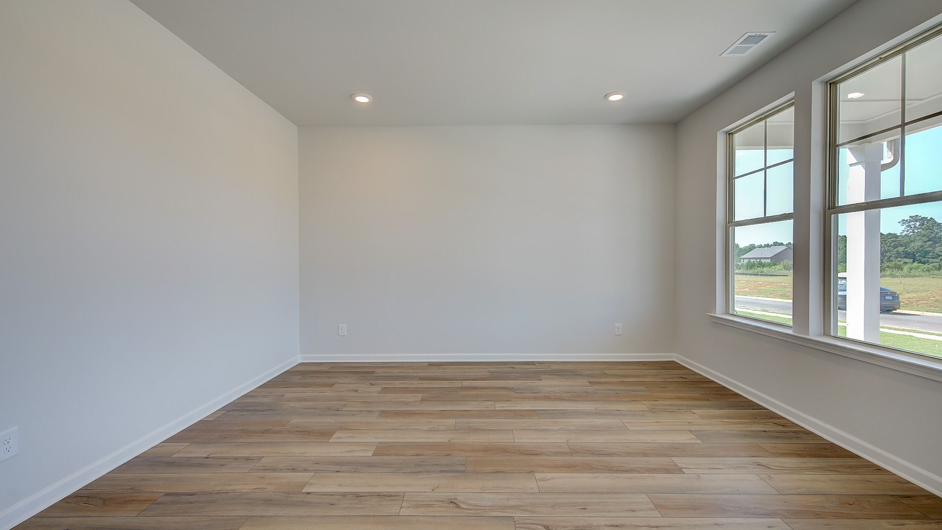 Stonefield study with natural light, neutral wall finishes, and LVP flooring at Brighton in Locust Grove, GA.