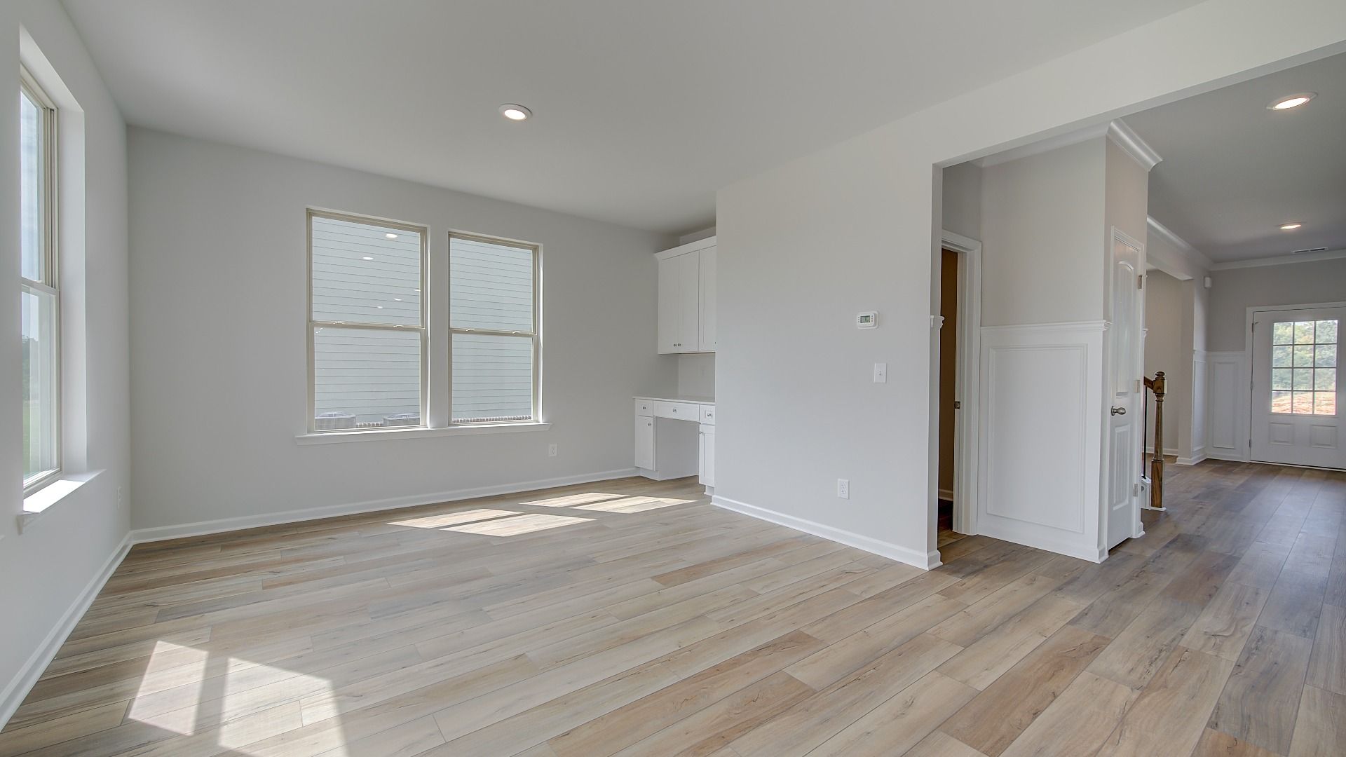 Stonefield open breakfast room with LVP flooring, natural light, and neutral finishes at Brighton in Locust Grove, GA.