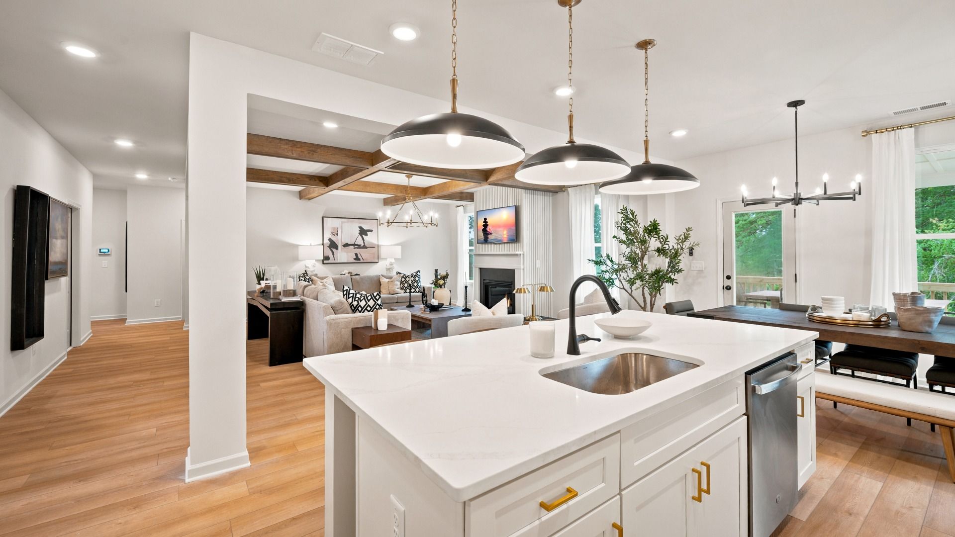 Bright open-concept kitchen with large island, pendant lighting, and modern finishes in the Rosemary II at Brighton.