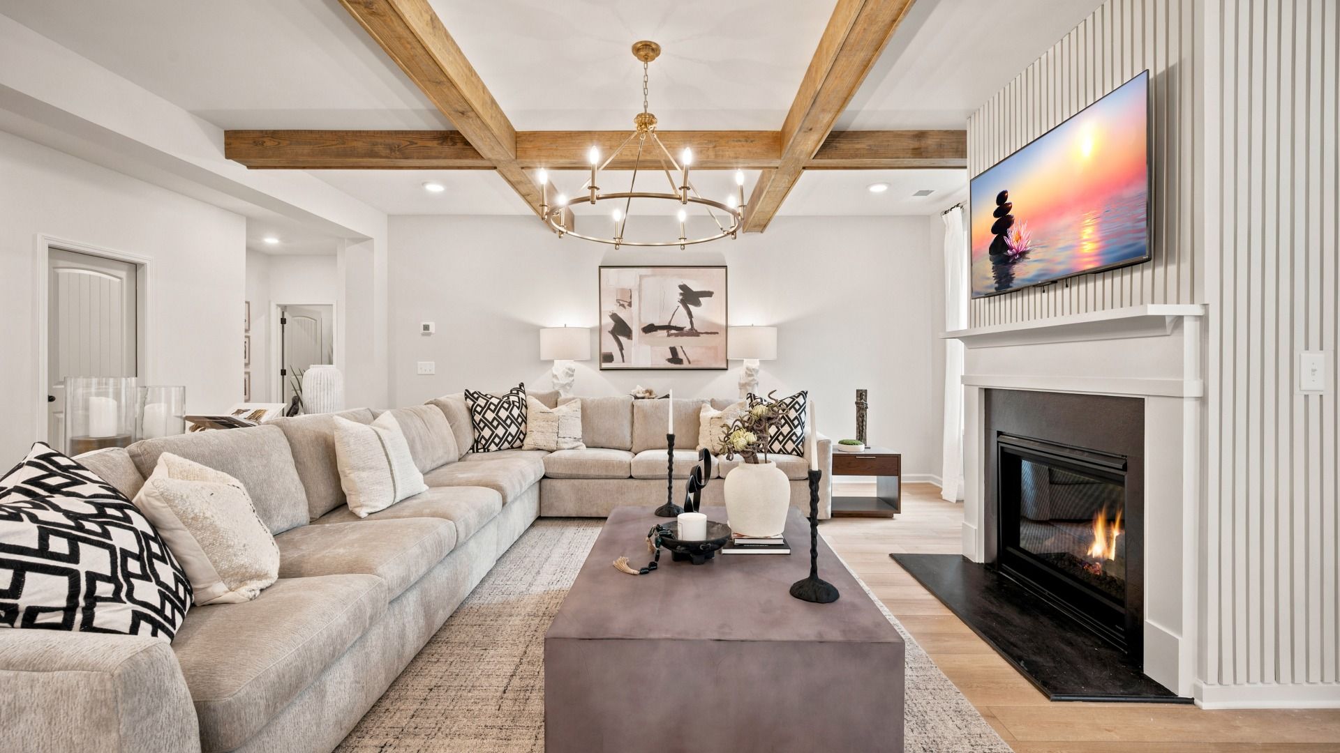 Open family room with center gas fireplace, natural light, and spacious seating area in the Rosemary II at Brighton.