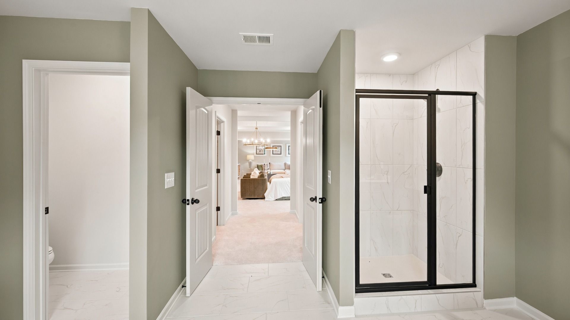 Rosemary II primary bath with modern tile-wall walk-in shower at Brighton in Locust Grove, GA.