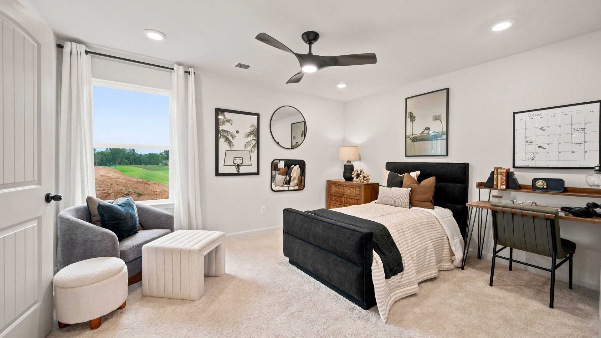 Rosemary II spacious secondary bedroom with carpet flooring, natural light, and neutral finishes at Brighton.