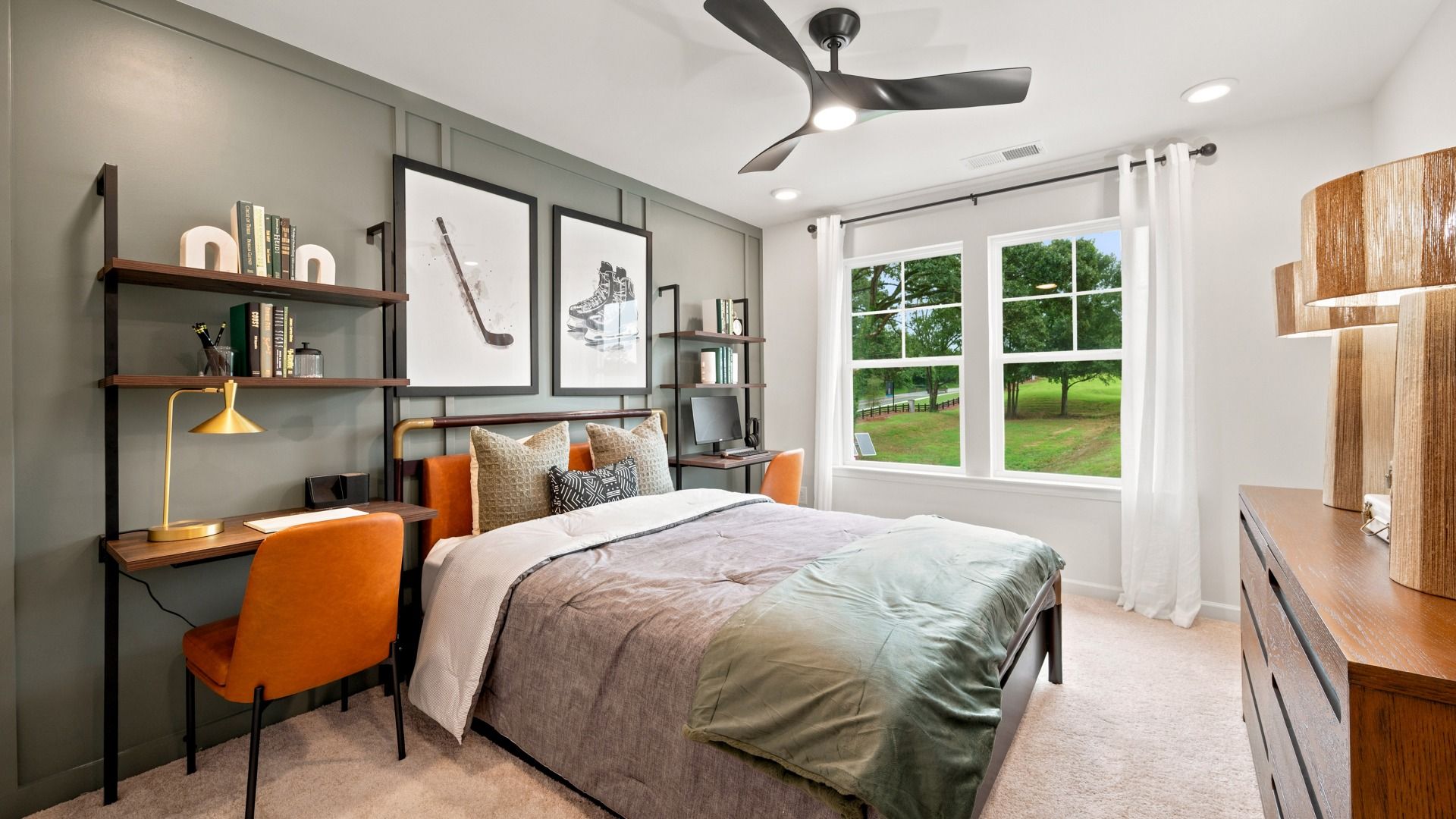 Secondary bedroom with carpet flooring, shiplap accent wall, and natural light in the Rosemary II at Brighton.