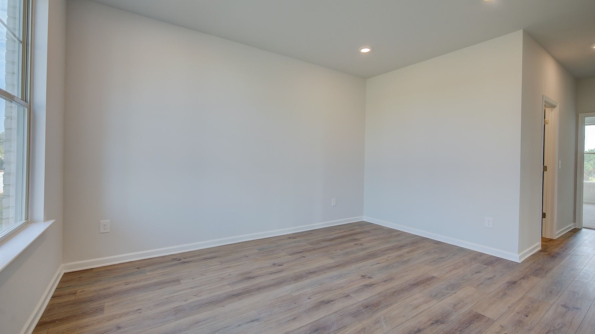 McKinley II flexible living space or home office with LVP flooring and natural light at Brighton in Locust Grove, GA.