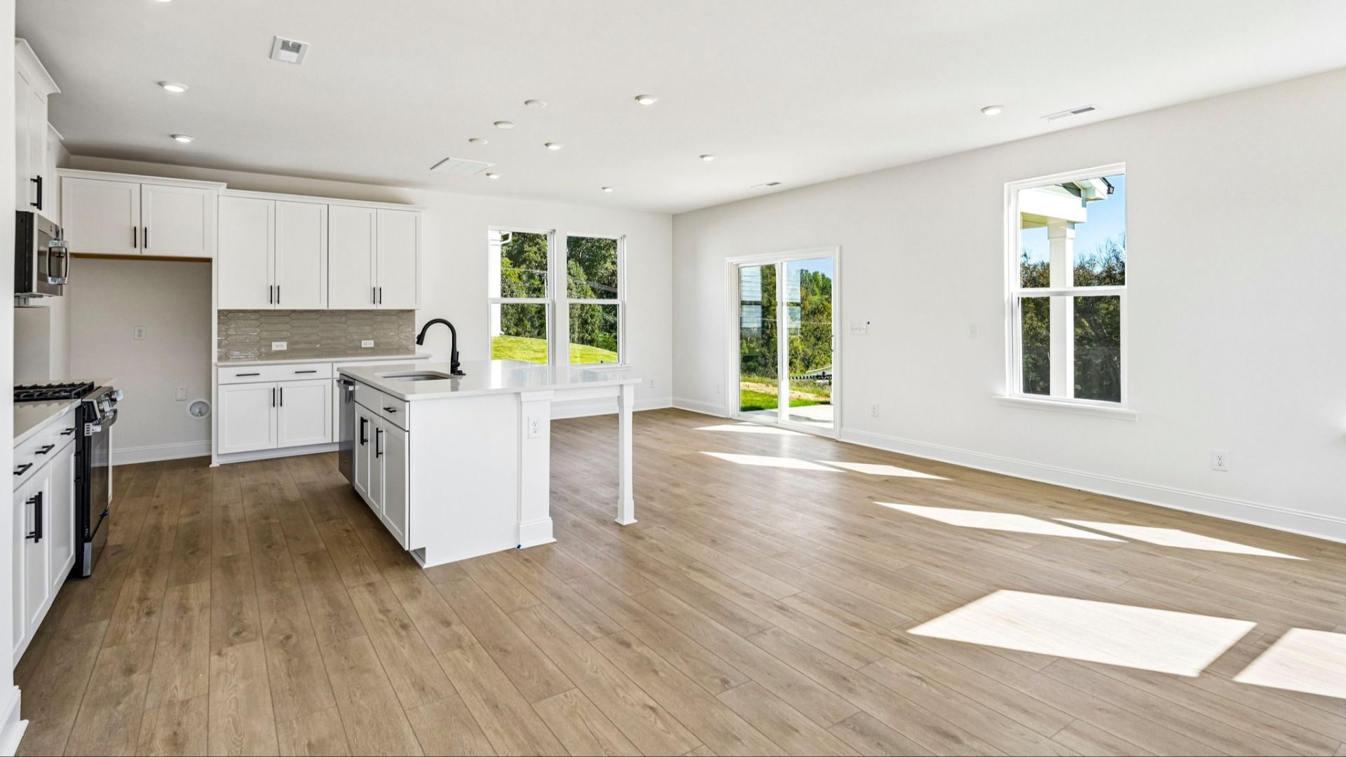 The Jasmine Plan by DRB Homes in Farms at Bellingham in Mooresville NC - Kitchen & Living space