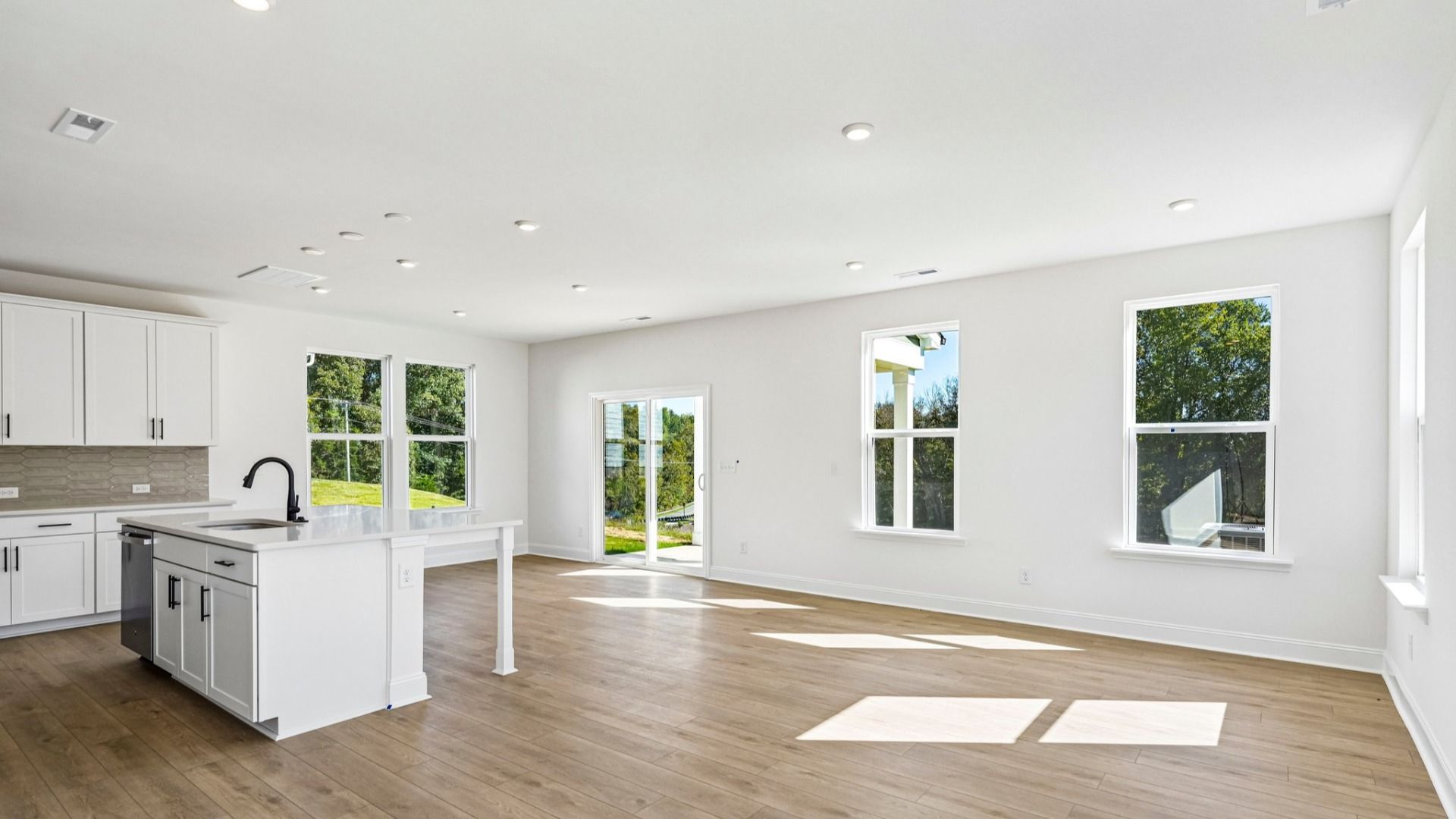The Jasmine Plan by DRB Homes in Farms at Bellingham in Mooresville NC - Kitchen & Living space