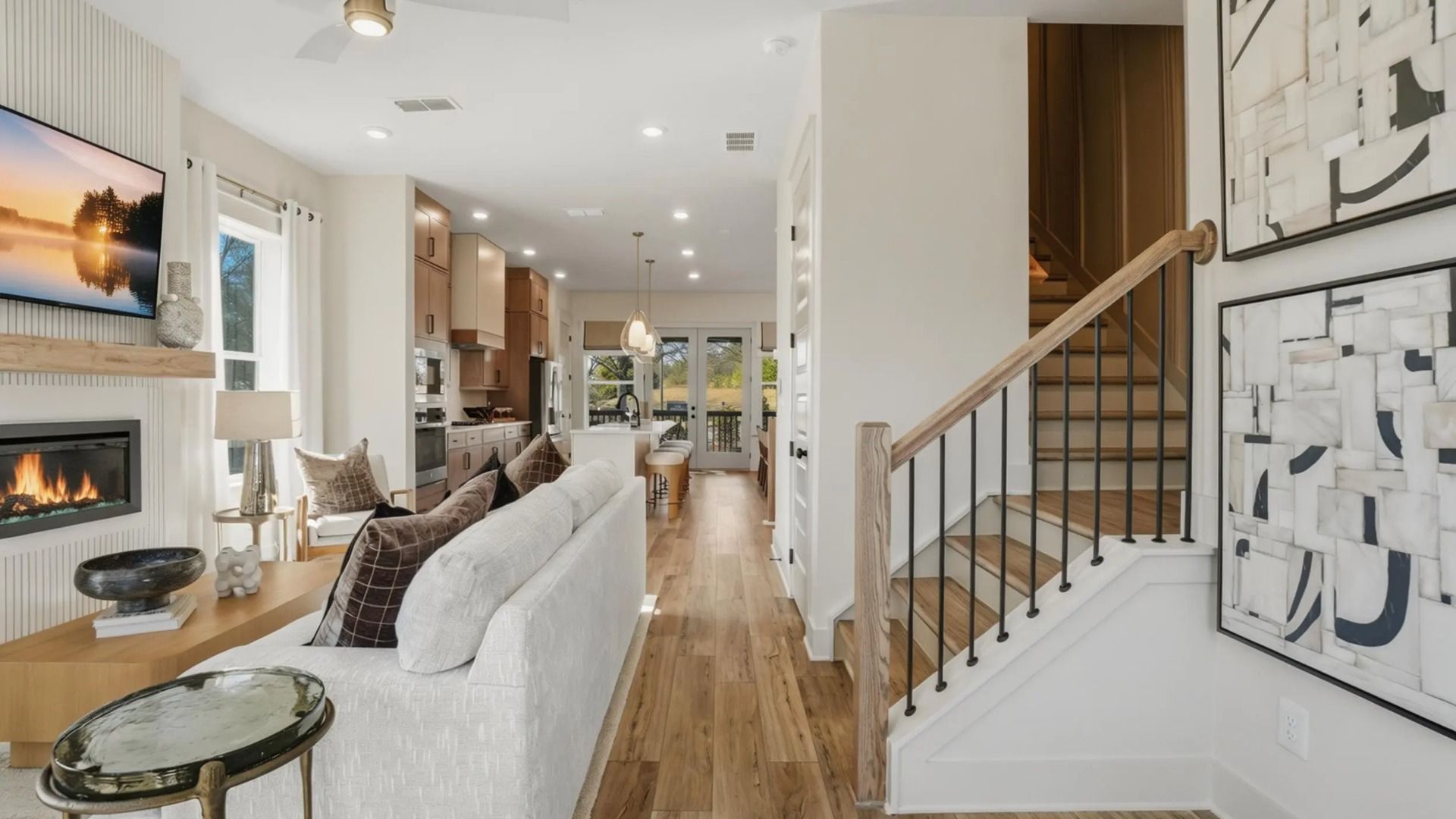 Spacious family room with statement fireplace wall and natural light in new construction townhome in Kennesaw, GA.