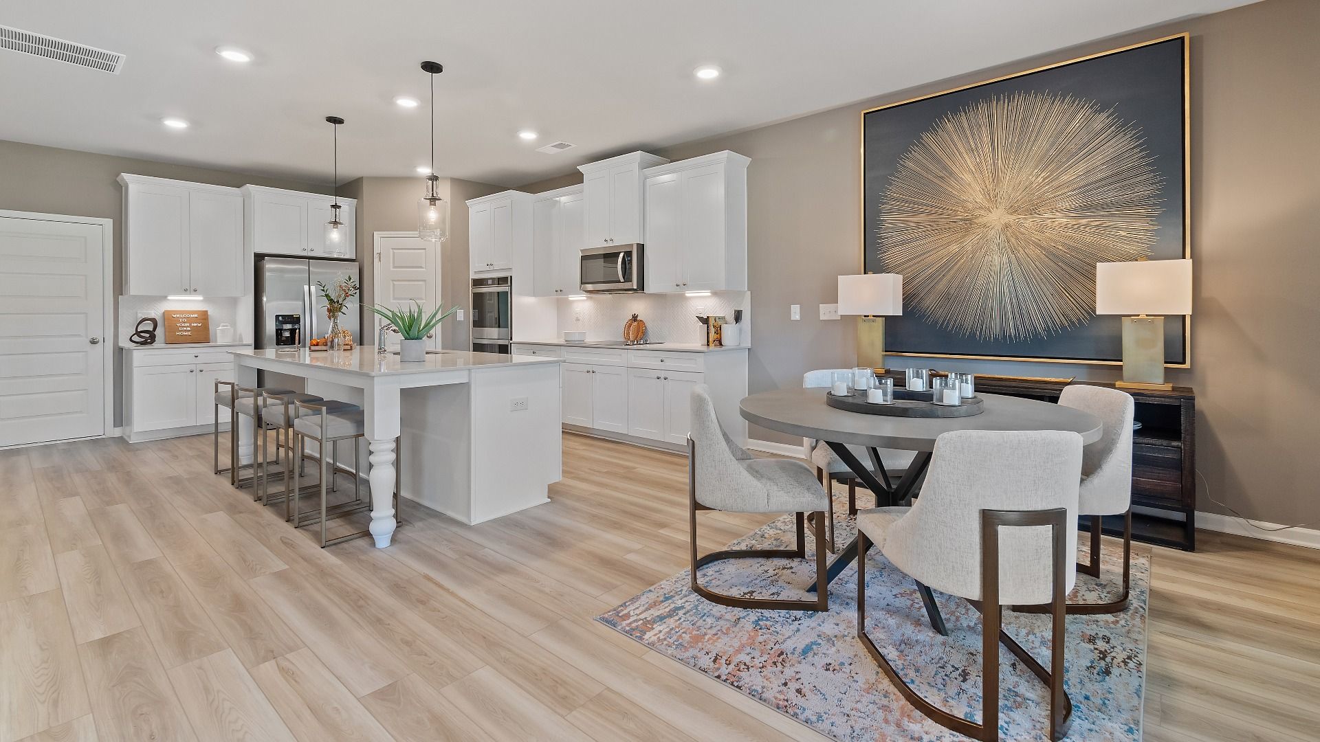 McKinley II breakfast area connected to kitchen with natural light and open layout at Brighton in Locust Grove, GA.
