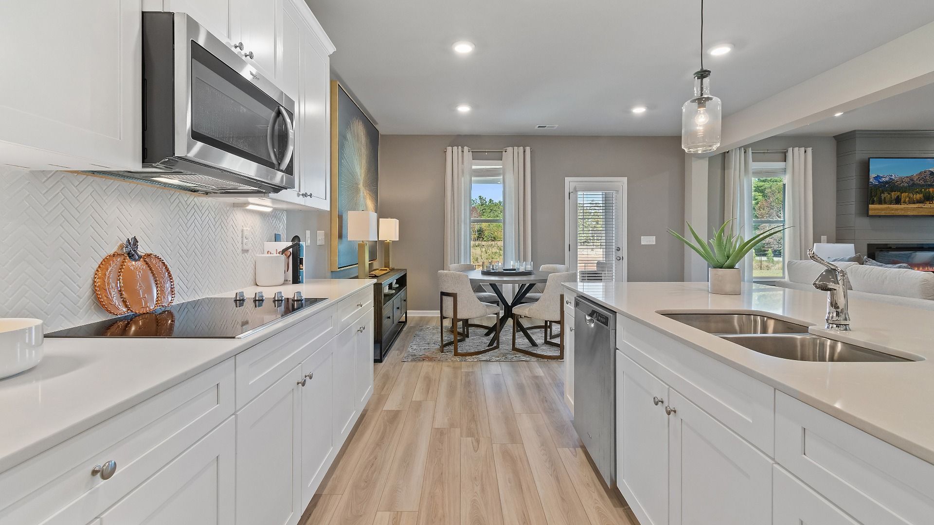 Spacious kitchen with LVP flooring, abundant counter space, and center island in the McKinley II at Brighton.