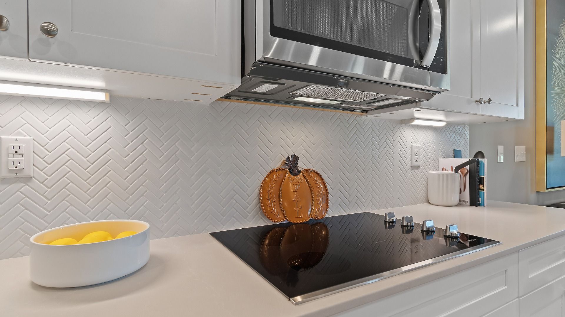 McKinley II kitchen with white tile backsplash and stainless-steel appliances at Brighton in Locust Grove, GA.