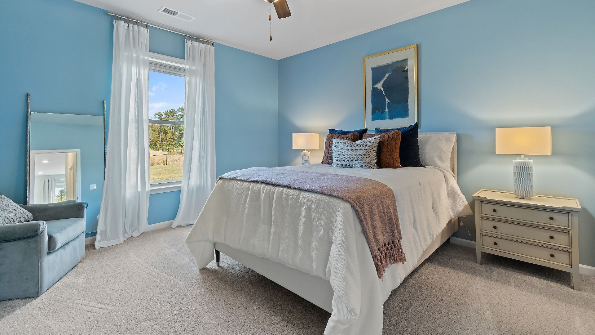 McKinley II secondary bedroom with carpet flooring and natural light at Brighton in Locust Grove, GA.