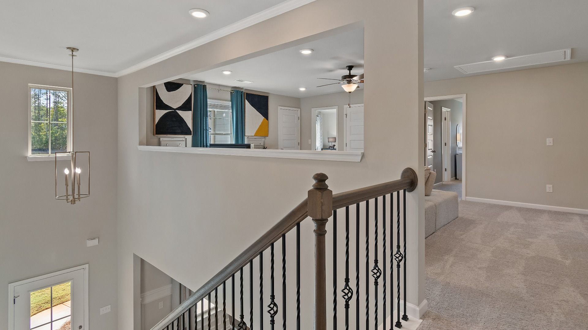 McKinley II upstairs landing with open hallway leading to loft at Brighton in Locust Grove, GA.